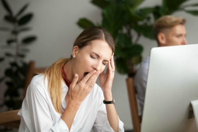 Woman yawning